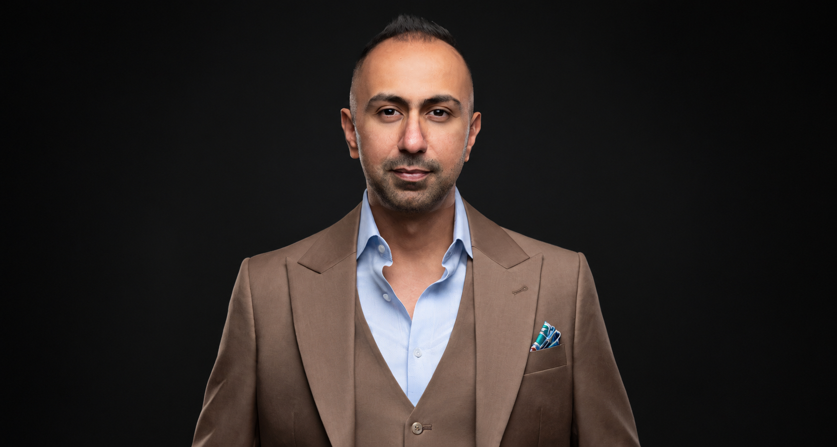 Jigar Sagar, entrepreneur and speaker, in a brown suit