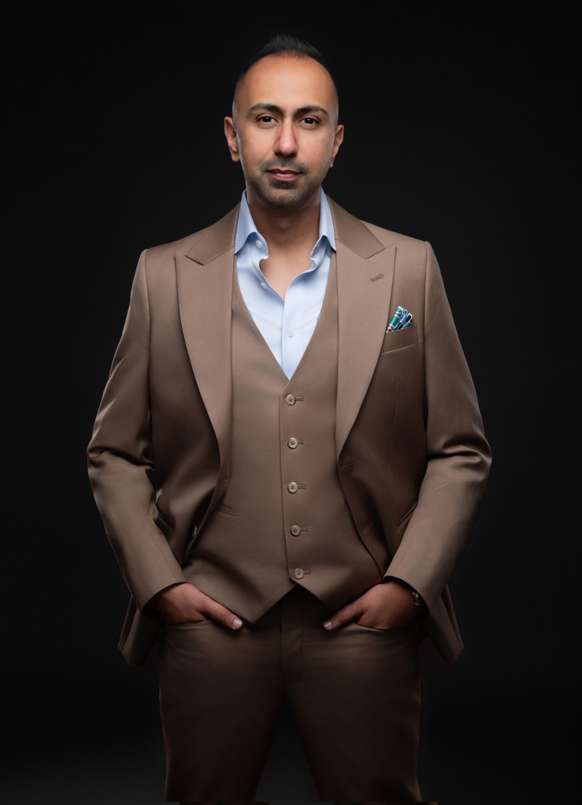 Jigar Sagar, entrepreneur and speaker, in a brown suit